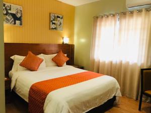 Postel nebo postele na pokoji v ubytování Coron Soleil Express Hotel