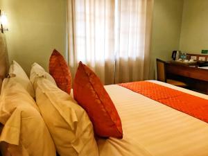 Postel nebo postele na pokoji v ubytování Coron Soleil Express Hotel