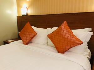 Postel nebo postele na pokoji v ubytování Coron Soleil Express Hotel