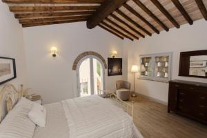 Postel nebo postele na pokoji v ubytování Agriturismo Due Comuni