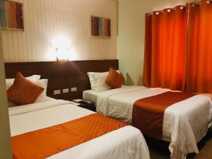 Postel nebo postele na pokoji v ubytování Coron Soleil Express Hotel
