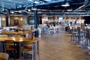 a restaurant with tables and chairs in a room at RJ Luxury Caravan Hire With Hot Tub in Tattershall