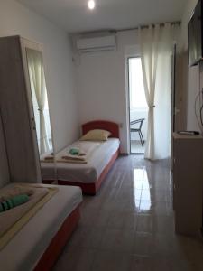 Postel nebo postele na pokoji v ubytování Apartmani Andrea-jaz