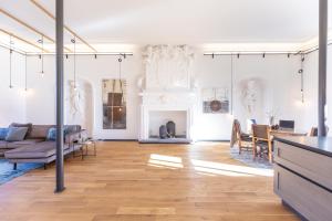 a living room with a couch and a fireplace at Ferienresidenz von Planta in Pratval