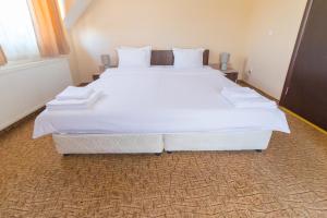 Postel nebo postele na pokoji v ubytování Ring Hotel