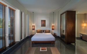 Ένα ή περισσότερα κρεβάτια σε δωμάτιο στο The Chedi Muscat