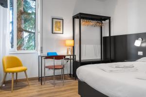 Postel nebo postele na pokoji v ubytování ParcoSantaTeresa Suites LOC-02279