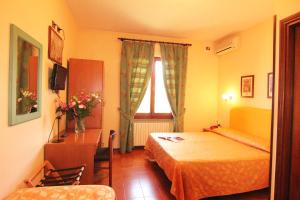 Postel nebo postele na pokoji v ubytování Hotel Boni Cerri