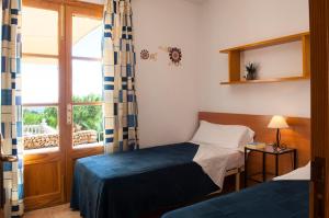 Postel nebo postele na pokoji v ubytování Finca Maria Magdalena Golf + 25 fotografií