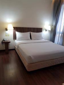Postel nebo postele na pokoji v ubytování 9 Square Hotel - Petaling Jaya