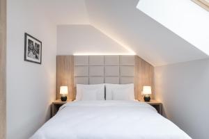 Posteľ alebo postele v izbe v ubytovaní Green Apartments
