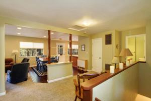 a living room with a couch and a dining room at Ormsby House in South Lake Tahoe