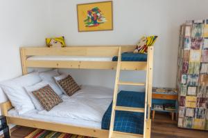 A bed or beds in a room at Servus Vendégház