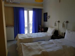 Postel nebo postele na pokoji v ubytování Hotel Miramare