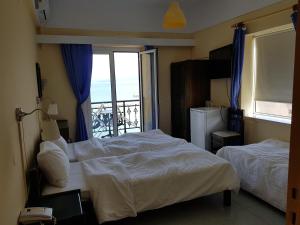 Postel nebo postele na pokoji v ubytování Hotel Miramare