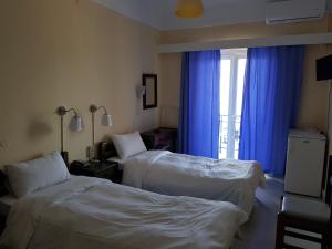 Postel nebo postele na pokoji v ubytování Hotel Miramare