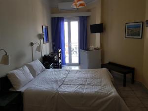 Postel nebo postele na pokoji v ubytování Hotel Miramare