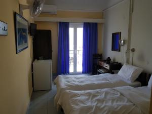 Postel nebo postele na pokoji v ubytování Hotel Miramare
