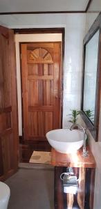 
a bathroom with a sink and a mirror at DiveGurus Boracay Beach Resort in Boracay
