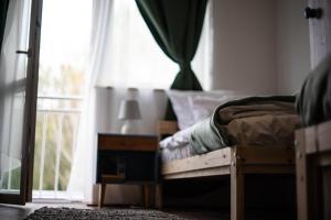 A bed or beds in a room at Servus Vendégház