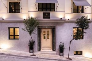 a facade of a building with a white door at Oniro City in Athens