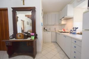 Kuchyň nebo kuchyňský kout v ubytování Apartments Neven