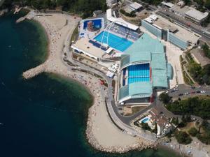 an aerial view of a building next to the water at NoAr Apartment Rijeka in Rijeka