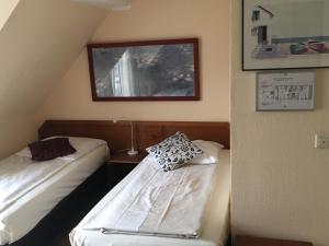 Postel nebo postele na pokoji v ubytování AltDüsseldorf
