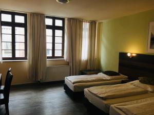 Postel nebo postele na pokoji v ubytování AltDüsseldorf