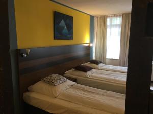 Postel nebo postele na pokoji v ubytování AltDüsseldorf