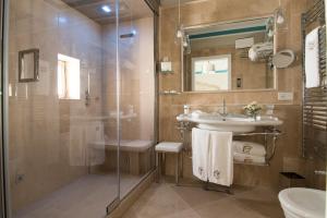 a bathroom with a sink and a shower at Hotel Don Ferrante in Monopoli