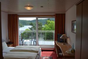 Postel nebo postele na pokoji v ubytování Seehotel Andree & Gästehaus Seehof