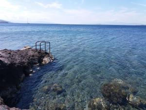 an object in the water next to a body of water at Ithaca in Perdika