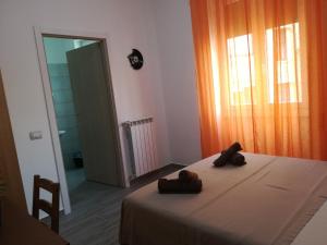 Postel nebo postele na pokoji v ubytování CASAMINA