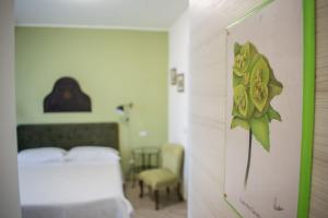 Postel nebo postele na pokoji v ubytování B&B Fleurs