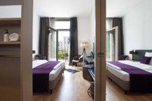 Postel nebo postele na pokoji v ubytování Hotel K99