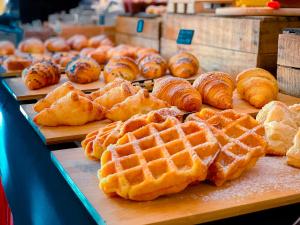 a display of bread and waffles and pastries on a table at Hotel Bonadies in Ravello