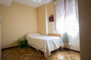Postel nebo postele na pokoji v ubytování VUT Plaza de la Fruta