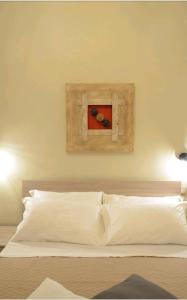 En eller flere senge i et værelse på B&B Napoli Storica