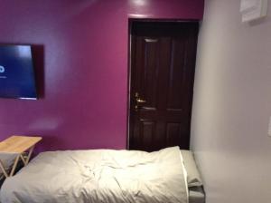 Postel nebo postele na pokoji v ubytování The Anfield Apartment