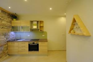 Kuchyň nebo kuchyňský kout v ubytování Desiderata Studio Apartment