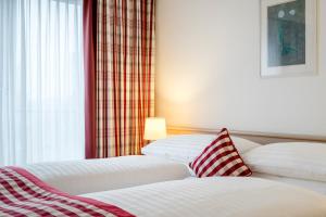 Posteľ alebo postele v izbe v ubytovaní Hotel IMLAUER & Bräu