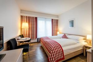 Posteľ alebo postele v izbe v ubytovaní Hotel IMLAUER & Bräu