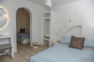 Cama o camas de una habitación en Porto Manolis