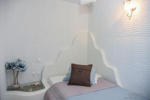 Кровать или кровати в номере Porto Manolis