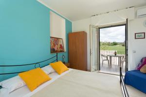 Una cama o camas en una habitación de Al Ficodindia