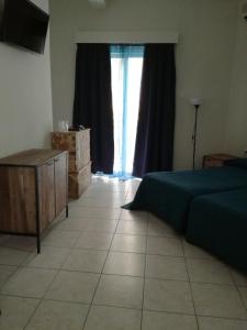 Postel nebo postele na pokoji v ubytování Hotel Marko