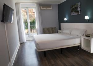 Postel nebo postele na pokoji v ubytování Hotel Gran Regente