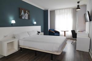 Postel nebo postele na pokoji v ubytování Hotel Gran Regente