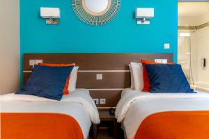 Letto o letti in una camera di Kyriad Avignon - Palais des Papes